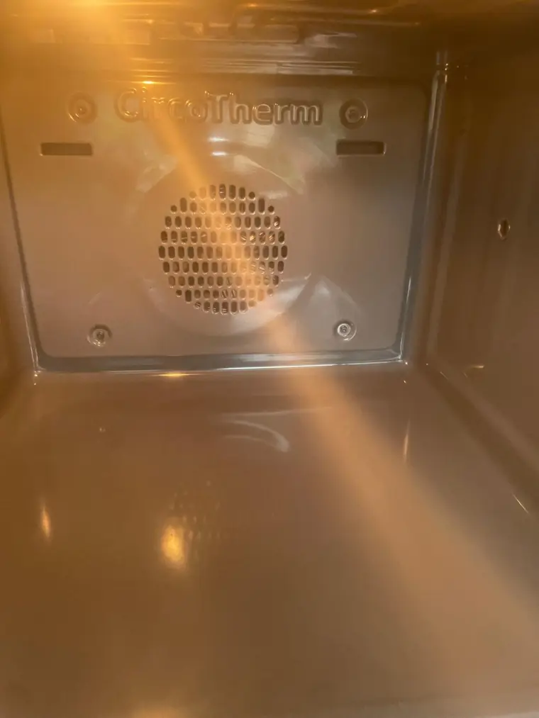 An oven interior after a replacement element and a professional clean